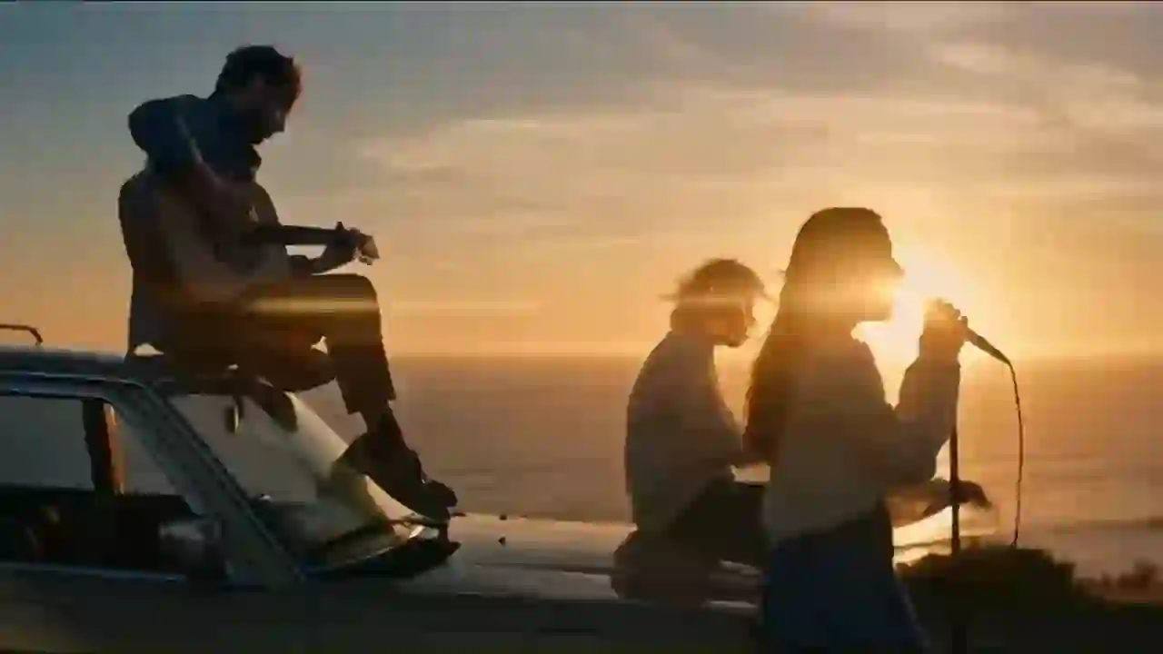 Seedance 1.5 example — silhouetted musicians performing by the sea at sunset